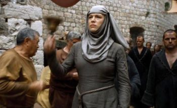 Septa Unella Game of Thrones Halloween costume styling reference showing grey maxi dress, grey head veil, rope belt, and brass shame bell