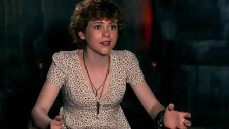 Beverly Marsh cosplay reference showing the floral dress and short curly red wig from IT