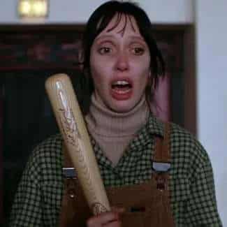 Wendy Torrance cosplay reference showing the character's brown corduroy overall dress, flannel overshirt, and the wooden baseball bat gripped defensively — the Overlook Hotel's survivor look