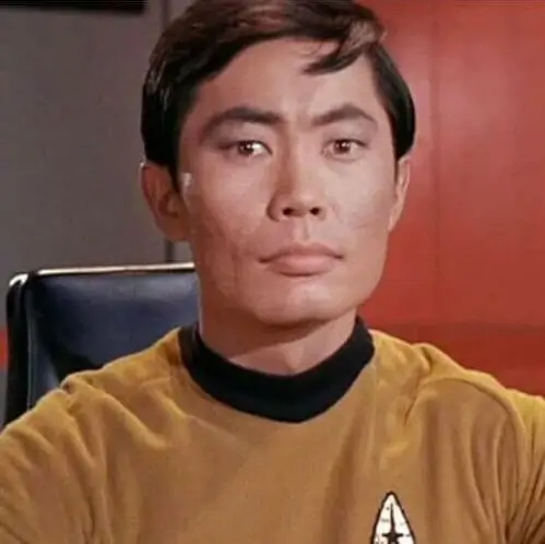 Hikaru Sulu in the gold Star Trek command uniform, a costume reference from the original series