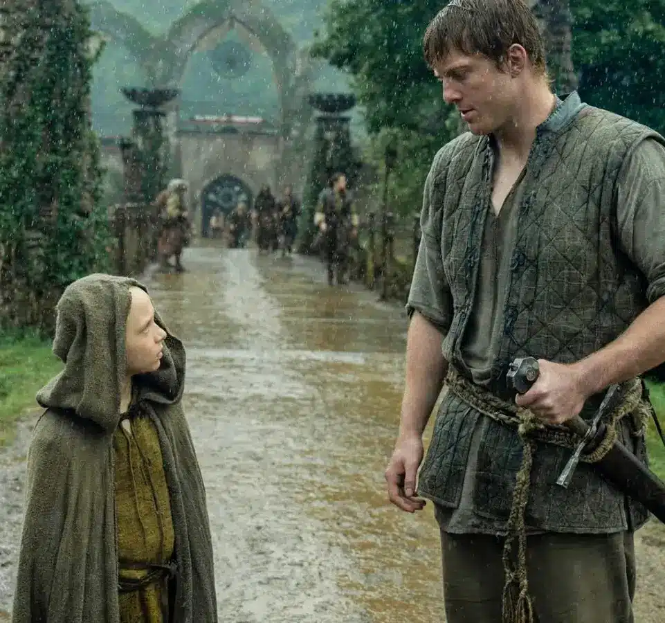 Ser Duncan the Tall and Egg walking side by side in A Knight of the Seven Kingdoms, the towering hedge knight beside his small bald squire, showing the Dunk and Egg duo Halloween costume reference