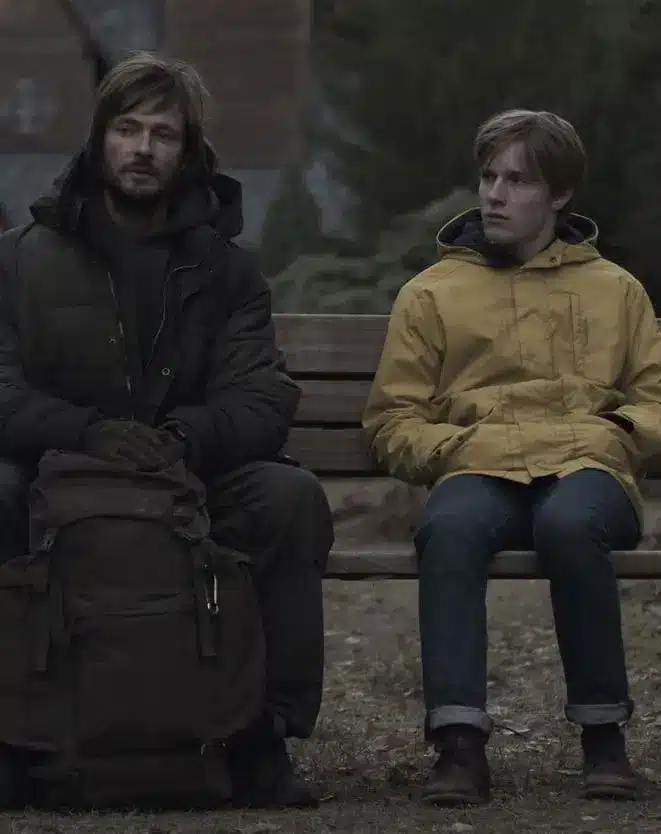 Jonas Kahnwald and The Stranger older Jonas sitting on a bench Dark Netflix