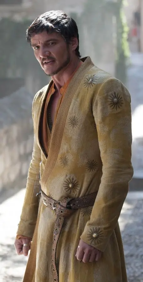 Oberyn Martell full body costume reference showing his loose yellow Dornish top, ring belt, brown trousers, and spear from Game of Thrones