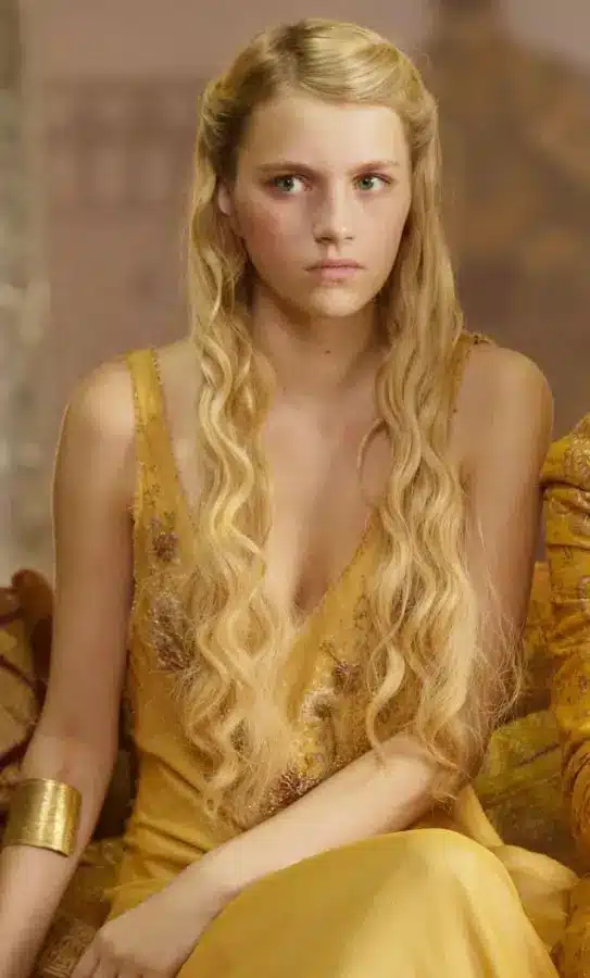 Princess Myrcella Baratheon in Game of Thrones wearing her Dornish yellow dress with blonde hair and floral accessories as a Halloween costume reference