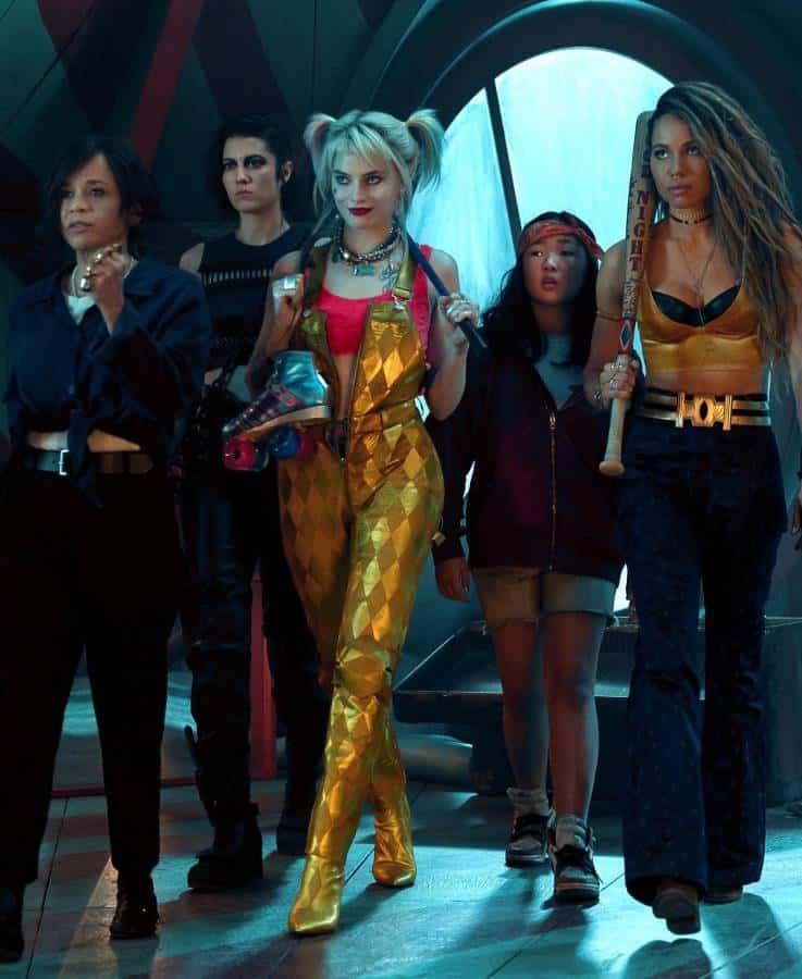 Renee Montoya, The Huntress, Harley Quinn, Cassandra Cain, and Black Canary from Birds of Prey 2020 standing together as a group, showing all five Halloween costume options side by side