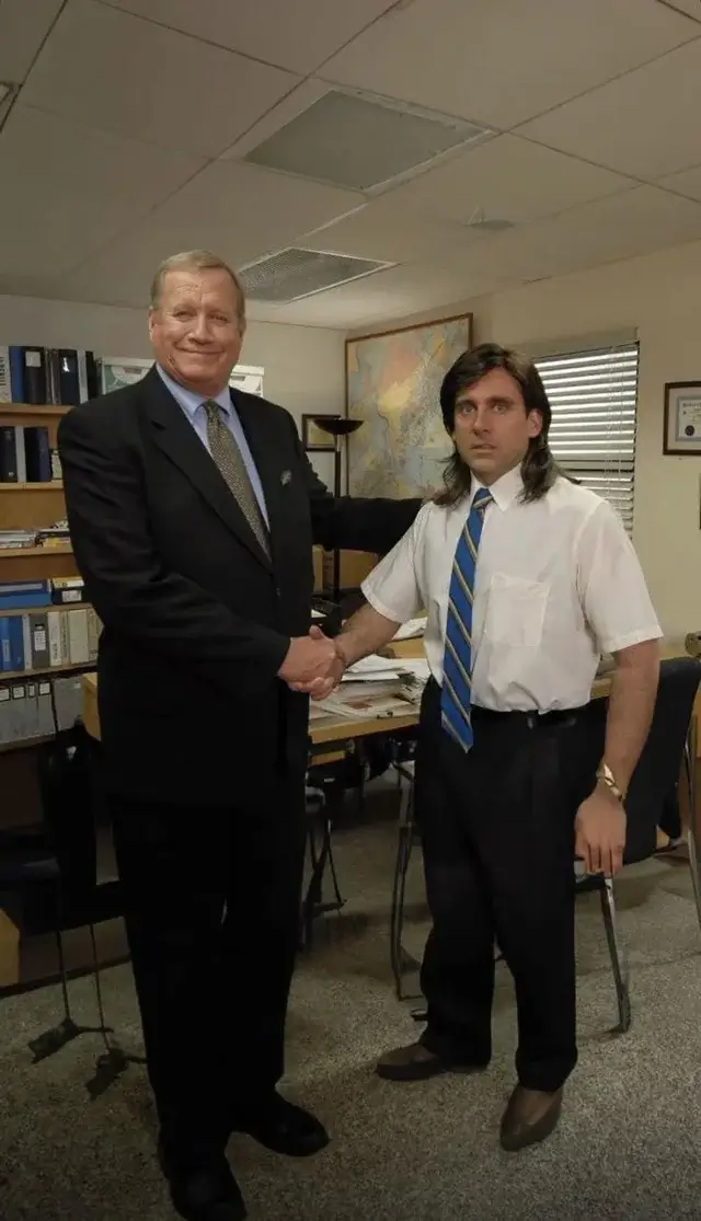 Young Michael Scott and Regional Manager Ed Truck shaking hands in the viral mullet and fanny pack photo from The Office