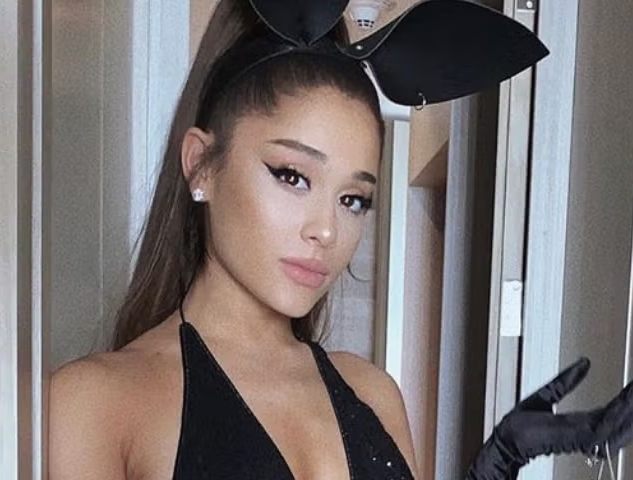 Ariana Grande wearing the black bunny mask and PVC outfit from the Dangerous Woman era for a group Halloween costume idea