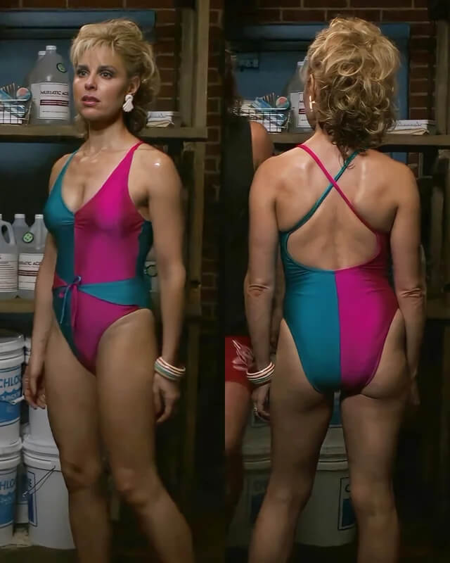 Mrs. Wheeler cosplay reference showing the front and back of the pink and teal color-blocked swimsuit with statement jewelry