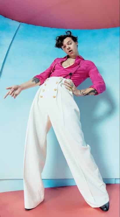Harry Styles Fine Line close-up costume reference showing gold rings, nail polish, and pink shirt detail