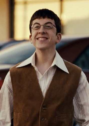 McLovin smiling pose costume reference showing full outfit with glasses and vest
