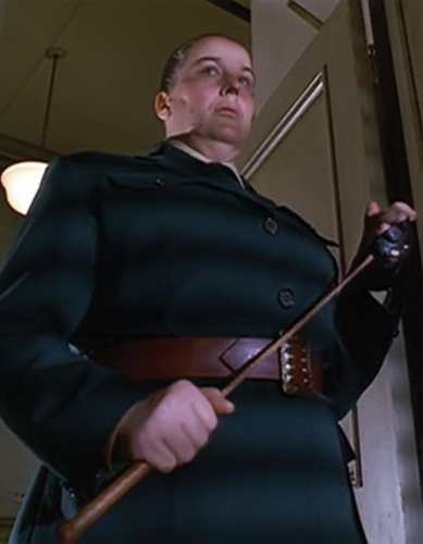 Miss Trunchbull costume reference holding the riding whip in a stern pose