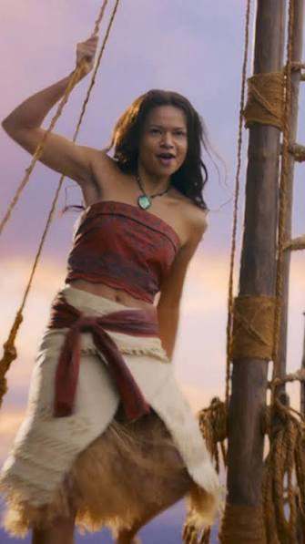 Close-up of Moana from the 2026 live-action film smiling, wearing the Heart of Te Fiti necklace and tribal-print top, reference for the Halloween costume