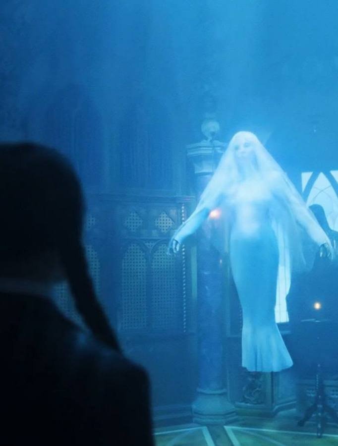 Rosaline Rotwood's ghostly white gown and sheer double-layer veil look from Wednesday season 2, reference image for the Halloween costume