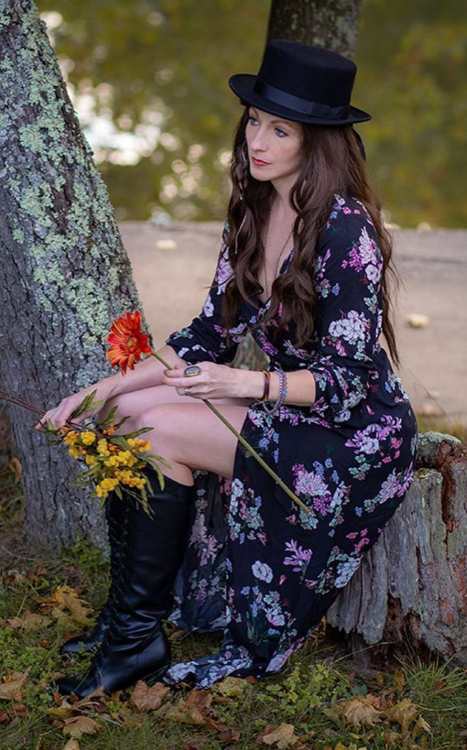 Front view of Rose the Hat's floral dress and layered wrist jewelry from Doctor Sleep, reference for the Halloween costume