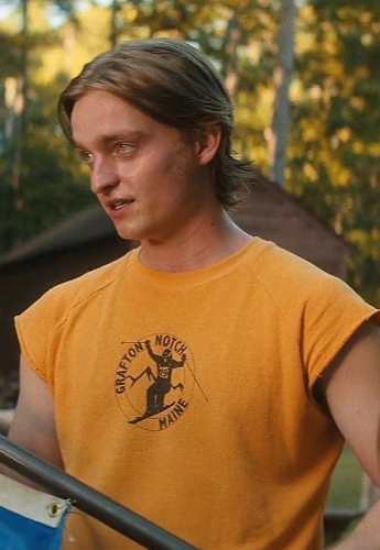 Tommy Slater from Fear Street Part Two 1978 wearing a red and black plaid flannel jacket over a yellow t-shirt, reference for the Halloween costume