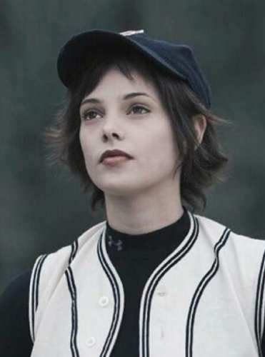 Alice Cullen pitching during the thunderstorm baseball scene in Twilight, wearing the black and white jersey and Cubs cap