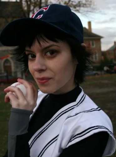 Alice Cullen's full baseball uniform costume reference from Twilight, showing the jersey, cap, and wig together
