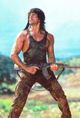 Rambo jungle survival costume reference showing the full tactical outfit with knife and bullet belt