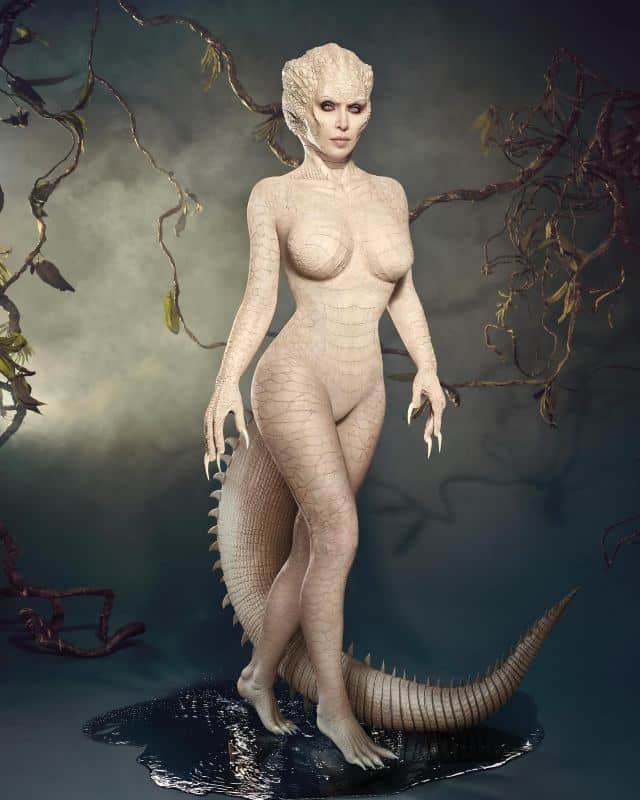 Kim Kardashian in a full-body pale albino alligator costume with a scaled head and long tail for Halloween 2024