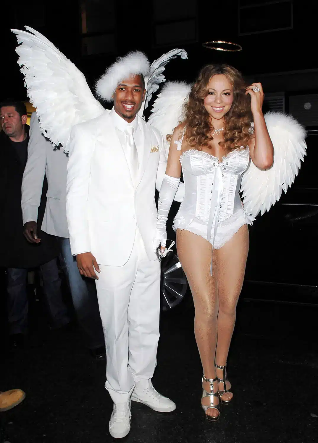 Mariah Carey and Nick Cannon dressed as angels in white wings for Halloween 2009