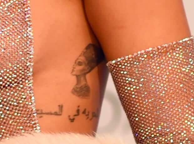 Rihanna's portrait tattoo of Egyptian queen Nefertiti on the left side of her ribcage