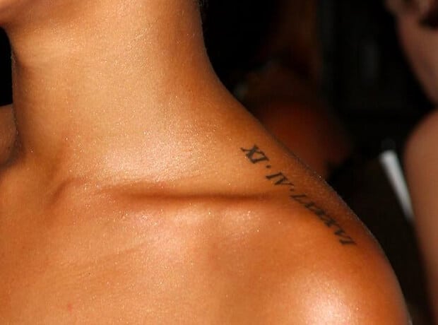 Roman numeral date tattoo on the back of Rihanna's left shoulder