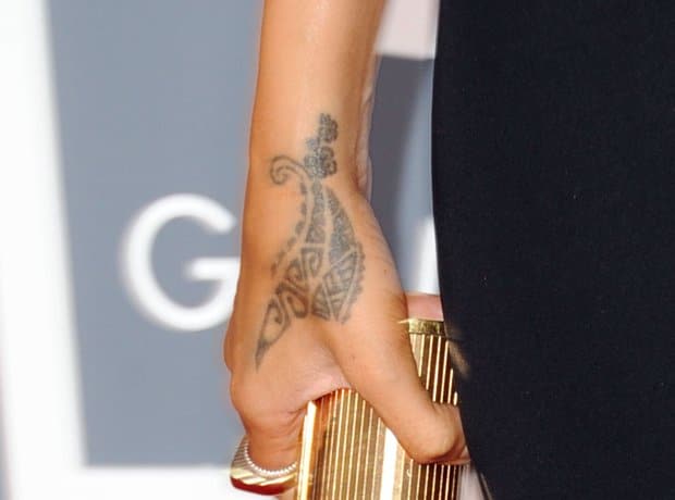Rihanna's traditional Maori tribal design on the side of her right hand before it was covered