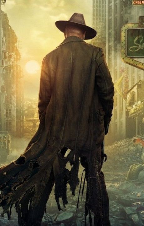 The Ghoul from Fallout seen from behind, wearing a tattered leather duster coat and wide-brimmed cowboy hat against a ruined city skyline